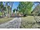 Features a mature landscaped yard with plenty of mature trees around the house at 530 Taylor Dr, Orange City, FL 32763