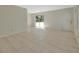 Open living space featuring tile floors, a sliding glass door, and ample natural light at 530 Taylor Dr, Orange City, FL 32763