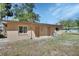 Features multiple entrances, including doors and windows, set against a backdrop of grass at 530 Taylor Dr, Orange City, FL 32763