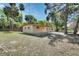 Home featuring an open yard, mature trees and landscaping, and neutral exterior paint at 530 Taylor Dr, Orange City, FL 32763