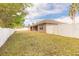 Fenced backyard featuring a covered patio and view of the home with neutral-tone siding at 69 Grey Dapple Way, Ormond Beach, FL 32174