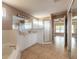 Bathroom with a tiled floor, double sink vanity, soaking tub, and glass enclosed shower at 69 Grey Dapple Way, Ormond Beach, FL 32174