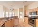 Well-equipped kitchen with stainless steel appliances and breakfast bar with casual dining area at 69 Grey Dapple Way, Ormond Beach, FL 32174