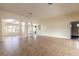 Open-concept living room featuring tile flooring, neutral paint, and ample natural light at 69 Grey Dapple Way, Ormond Beach, FL 32174