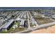 Sweeping aerial view of a community near the water and adjacent to a beautiful beach at 7 Kathy Dr, Ormond Beach, FL 32176