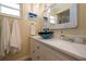 Stylish bathroom showcasing a unique vessel sink, custom vanity, and beach-themed decor at 7 Kathy Dr, Ormond Beach, FL 32176