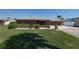 Charming brick home with manicured lawn and easy access to the 2 car garage on a sunny day at 7 Kathy Dr, Ormond Beach, FL 32176