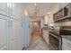Modern kitchen with stainless steel appliances, granite counters, and ample storage at 7 Kathy Dr, Ormond Beach, FL 32176