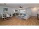 Comfortable living room, decorated with coastal accents, connecting to the dining and kitchen areas at 7 Kathy Dr, Ormond Beach, FL 32176