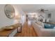 Bright, open living area with wood floors, coastal decor, and comfortable seating, great for entertaining at 7 Kathy Dr, Ormond Beach, FL 32176