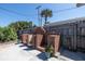 Outdoor brick fireplace and mature landscaping enhance the charm of this backyard at 7 Kathy Dr, Ormond Beach, FL 32176