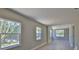 Sunlit room with natural light offers a view of the backyard, featuring wood grain floors at 709 Cedar St, Daytona Beach, FL 32114