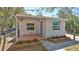 Charming home featuring a lovely brick patio and garden beds adding to its curb appeal at 709 Cedar St, Daytona Beach, FL 32114