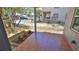 Tiled front porch featuring planting beds, mature shade trees, and views of the surrounding neighborhood at 709 Cedar St, Daytona Beach, FL 32114