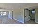 A naturally lit living room with wood grain floors and multiple entryways at 709 Cedar St, Daytona Beach, FL 32114