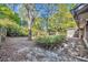 Backyard view with mature landscaping and screen porch at 715 Oak Ter, Orange City, FL 32763