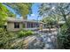 Backyard view showing the screen porch, home, and landscaping at 715 Oak Ter, Orange City, FL 32763