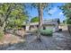 View of backyard and the rear of the home with screen porch at 715 Oak Ter, Orange City, FL 32763