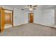 Spacious carpeted bedroom with multiple doorways at 715 Oak Ter, Orange City, FL 32763