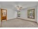 Cozy bedroom with carpet floors, ceiling fan, and natural light from two windows at 715 Oak Ter, Orange City, FL 32763