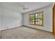 Bedroom with neutral carpet, large window, and ceiling fan at 715 Oak Ter, Orange City, FL 32763