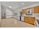 Sunny kitchen with ample counter space, stainless steel refrigerator, and a view to dining area at 715 Oak Ter, Orange City, FL 32763