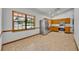 Open kitchen featuring stainless steel appliances, wood cabinets, and a view of the front yard at 715 Oak Ter, Orange City, FL 32763