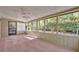 Screened porch with beadboard ceiling and view of the backyard at 715 Oak Ter, Orange City, FL 32763