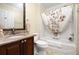 Bathroom with shower, vanity, framed mirror, and granite countertop at 7462 Se 172Nd Fieldcrest St, The Villages, FL 32162