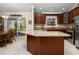 Beautiful kitchen with a large island, stainless steel appliances, and a dining area at 7462 Se 172Nd Fieldcrest St, The Villages, FL 32162
