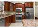 Well-equipped kitchen featuring stainless steel appliances and granite countertops at 7462 Se 172Nd Fieldcrest St, The Villages, FL 32162