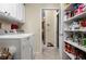 Laundry room with modern washer and dryer, white cabinets, and tile flooring at 7462 Se 172Nd Fieldcrest St, The Villages, FL 32162