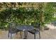 Outdoor seating on a shaded patio, perfect for enjoying a meal or a quiet moment at 7462 Se 172Nd Fieldcrest St, The Villages, FL 32162