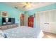 Bedroom with a ceiling fan and closet with white louvered doors at 811 Smokerise Blvd, Port Orange, FL 32127