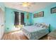 Comfortable bedroom with light hardwood floors and a window with light streaming in at 811 Smokerise Blvd, Port Orange, FL 32127