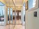 Bright hallway featuring full mirrored closet doors and tile flooring at 811 Smokerise Blvd, Port Orange, FL 32127