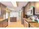 Updated kitchen featuring stainless steel appliances, granite countertops, and modern cabinetry at 811 Smokerise Blvd, Port Orange, FL 32127