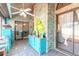 Bright sunroom with a vaulted ceiling, brick accent wall, and large glass windows at 811 Smokerise Blvd, Port Orange, FL 32127