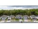 Aerial view of homes and the community showing well-manicured lawns, landscaping, and the surrounding green spaces at 9033 Cape Cod Rd, Deland, FL 32724