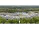 Community aerial view highlighting the area's ponds and lush green tree coverage at 9033 Cape Cod Rd, Deland, FL 32724