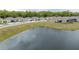 View of community homes surrounding a scenic pond at 9033 Cape Cod Rd, Deland, FL 32724