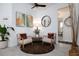 Cozy sitting area featuring two chairs, modern decor, and light wood-look flooring at 9033 Cape Cod Rd, Deland, FL 32724