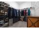 Spacious walk-in closet with custom shelving, rod system, drawers, and organized storage solutions for clothes and accessories at 9033 Cape Cod Rd, Deland, FL 32724