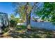Large tree in the backyard, along with a white fence at 912 Tree Garden Dr, Port Orange, FL 32127