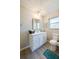 Bathroom boasts a single vanity, updated light fixture, and plenty of storage at 912 Tree Garden Dr, Port Orange, FL 32127