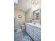 The bathroom features a white vanity and patterned floor mat at 912 Tree Garden Dr, Port Orange, FL 32127