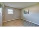 Empty bedroom showcasing wood-look floors and abundant natural light at 912 Tree Garden Dr, Port Orange, FL 32127