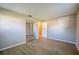 Bedroom with wood-look floors and a sliding-door closet at 912 Tree Garden Dr, Port Orange, FL 32127
