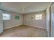 Empty bedroom features hardwood floors, a ceiling fan, and ample natural light at 912 Tree Garden Dr, Port Orange, FL 32127