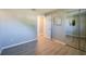 This bedroom features wood-look floors and a sliding-door closet at 912 Tree Garden Dr, Port Orange, FL 32127